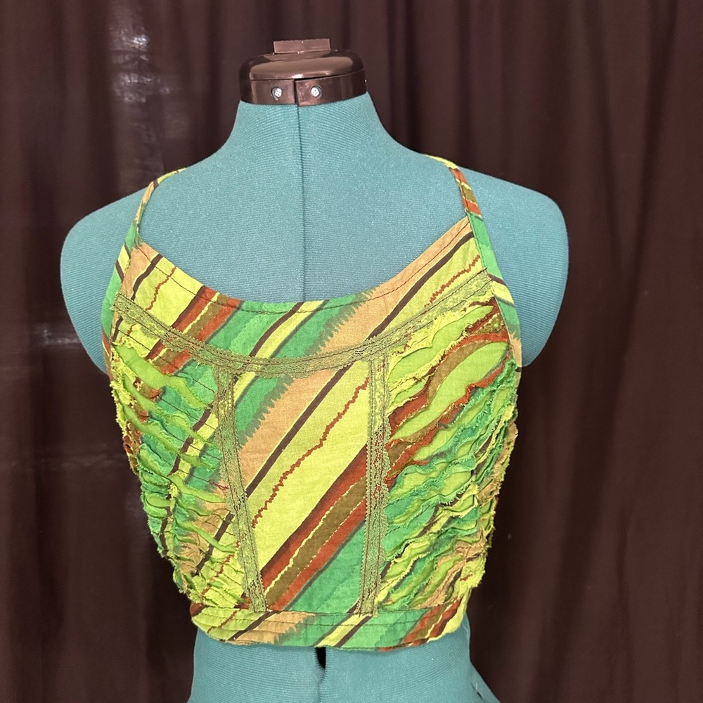 Multicolored sleeveless spaghetti strap crop tank top with ruched style features